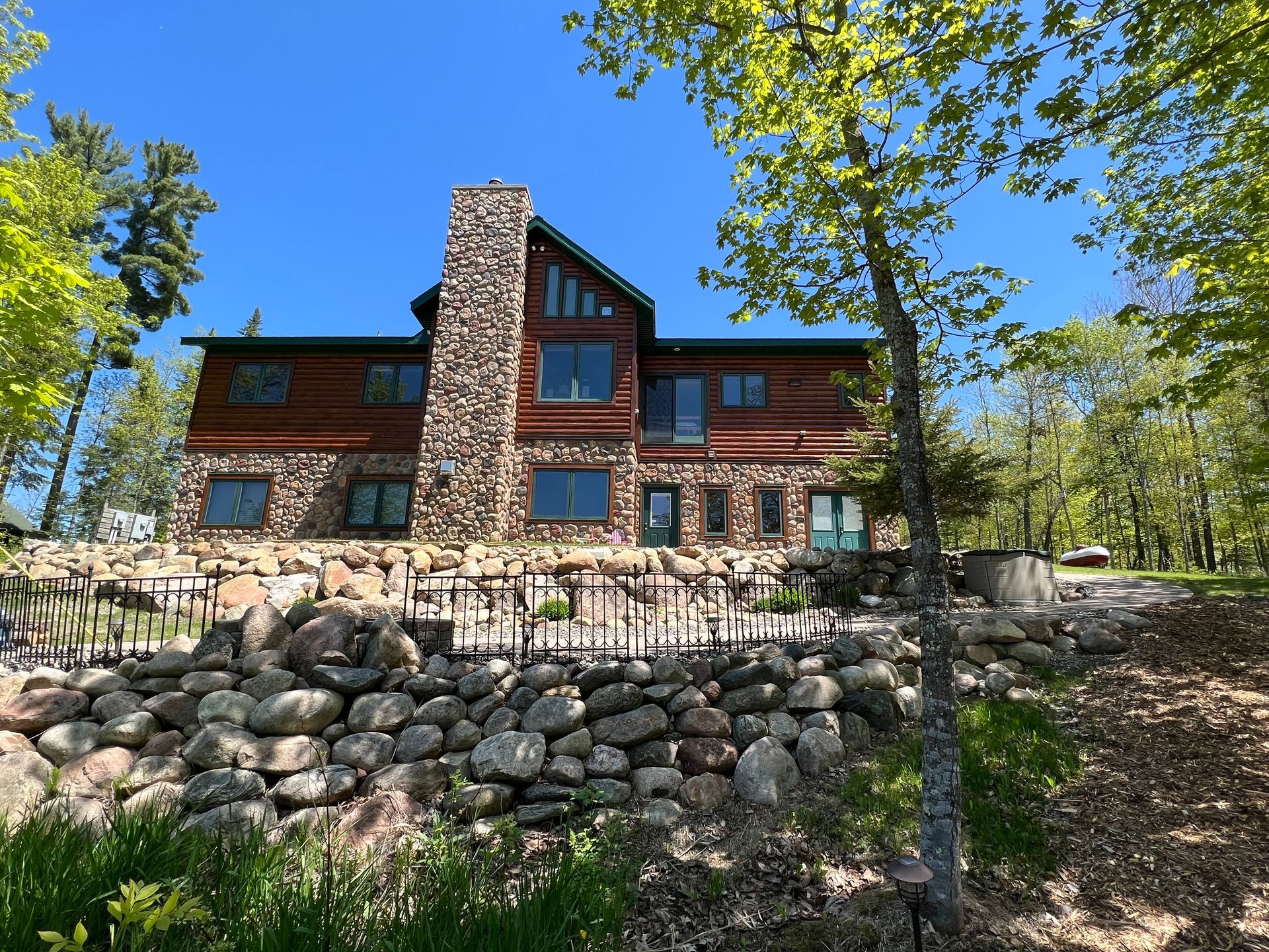 A Large Stone House – MN - Lifetime Staining and Log Restoration