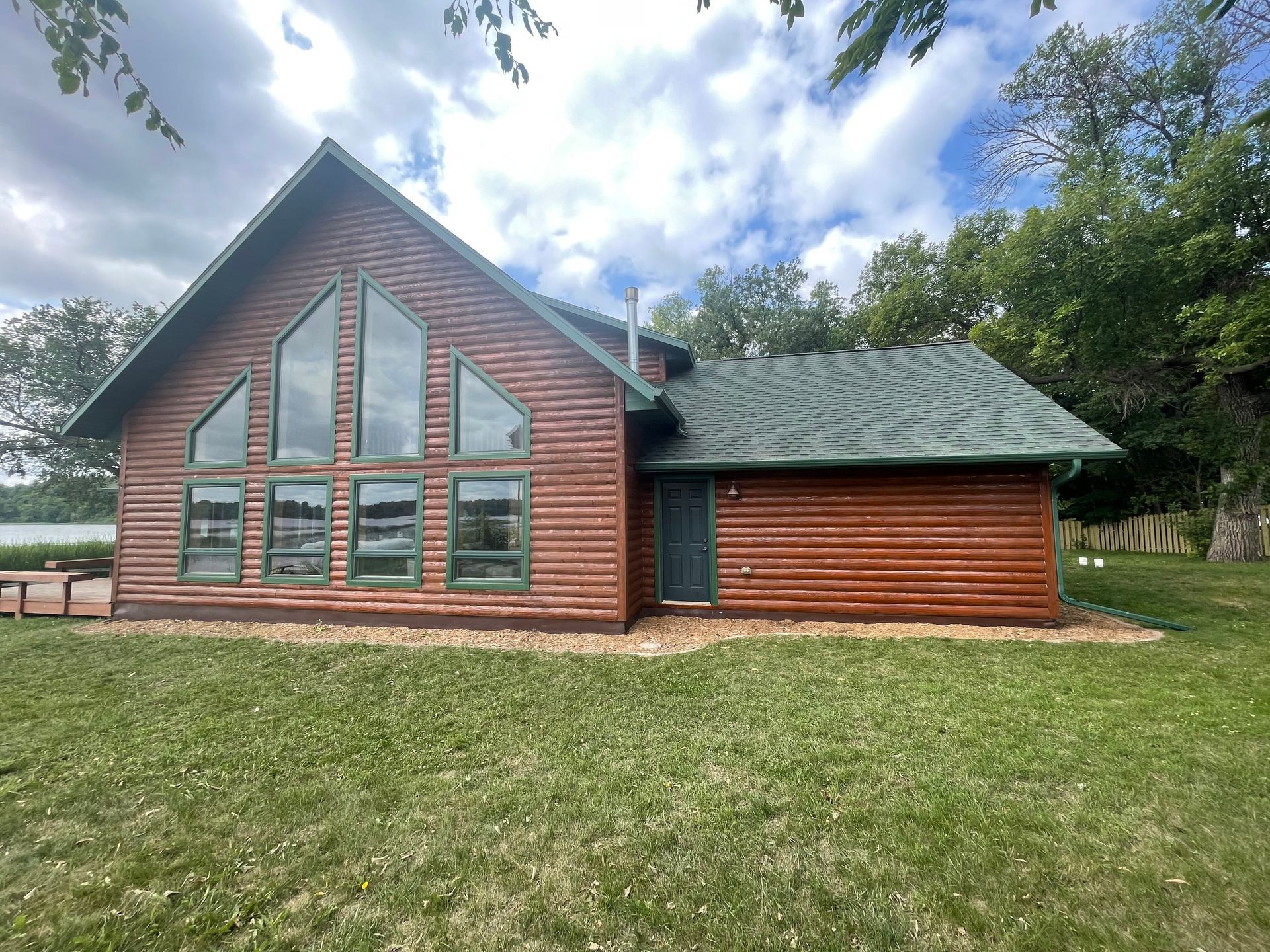 A Large Log Cabin With a Roof – MN - Lifetime Staining and Log Restoration