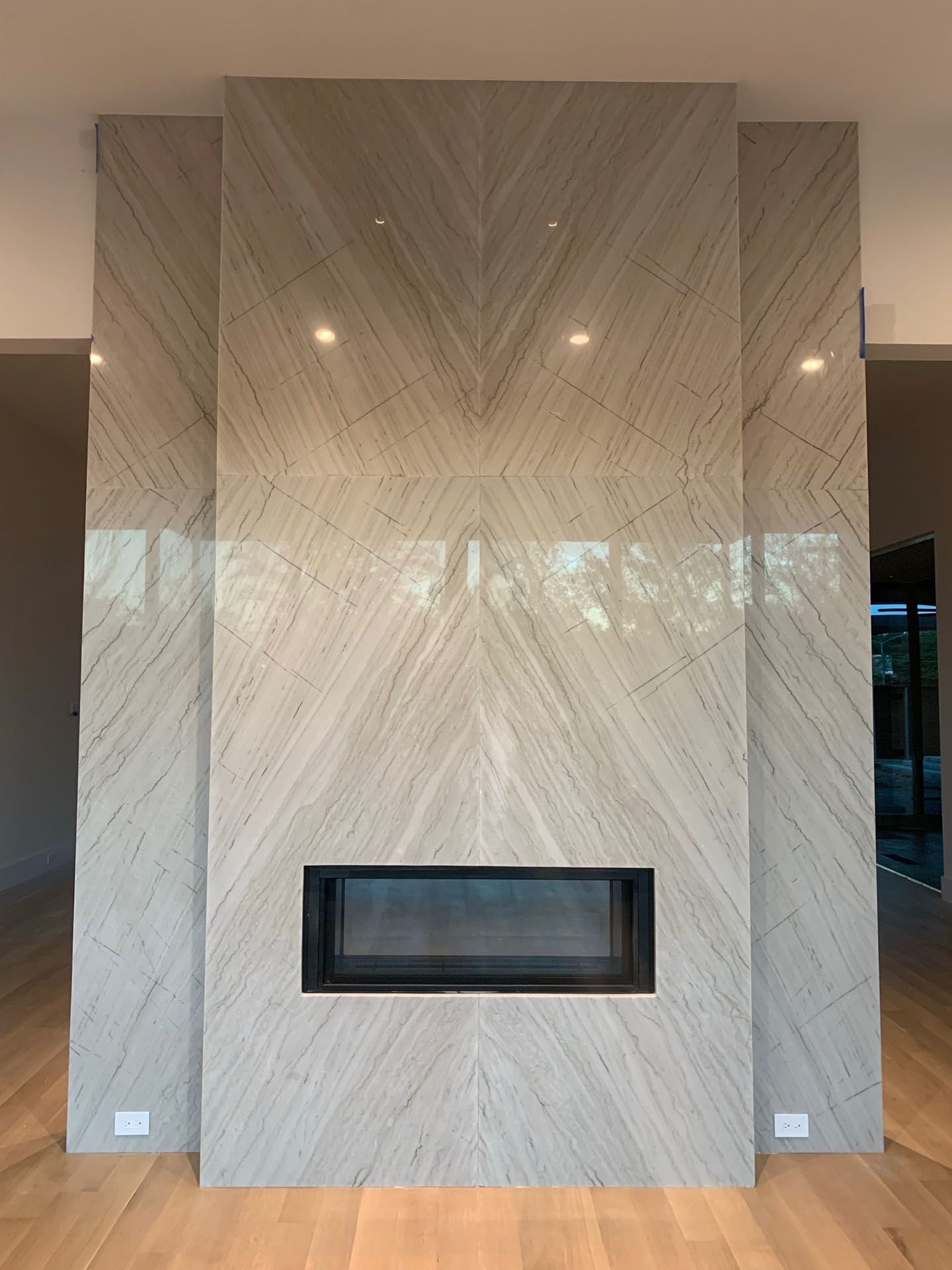 There is a fireplace in the middle of the room