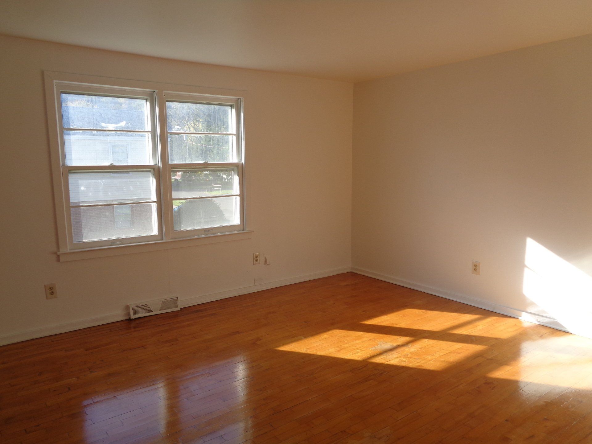 Apartment living room area with large windows