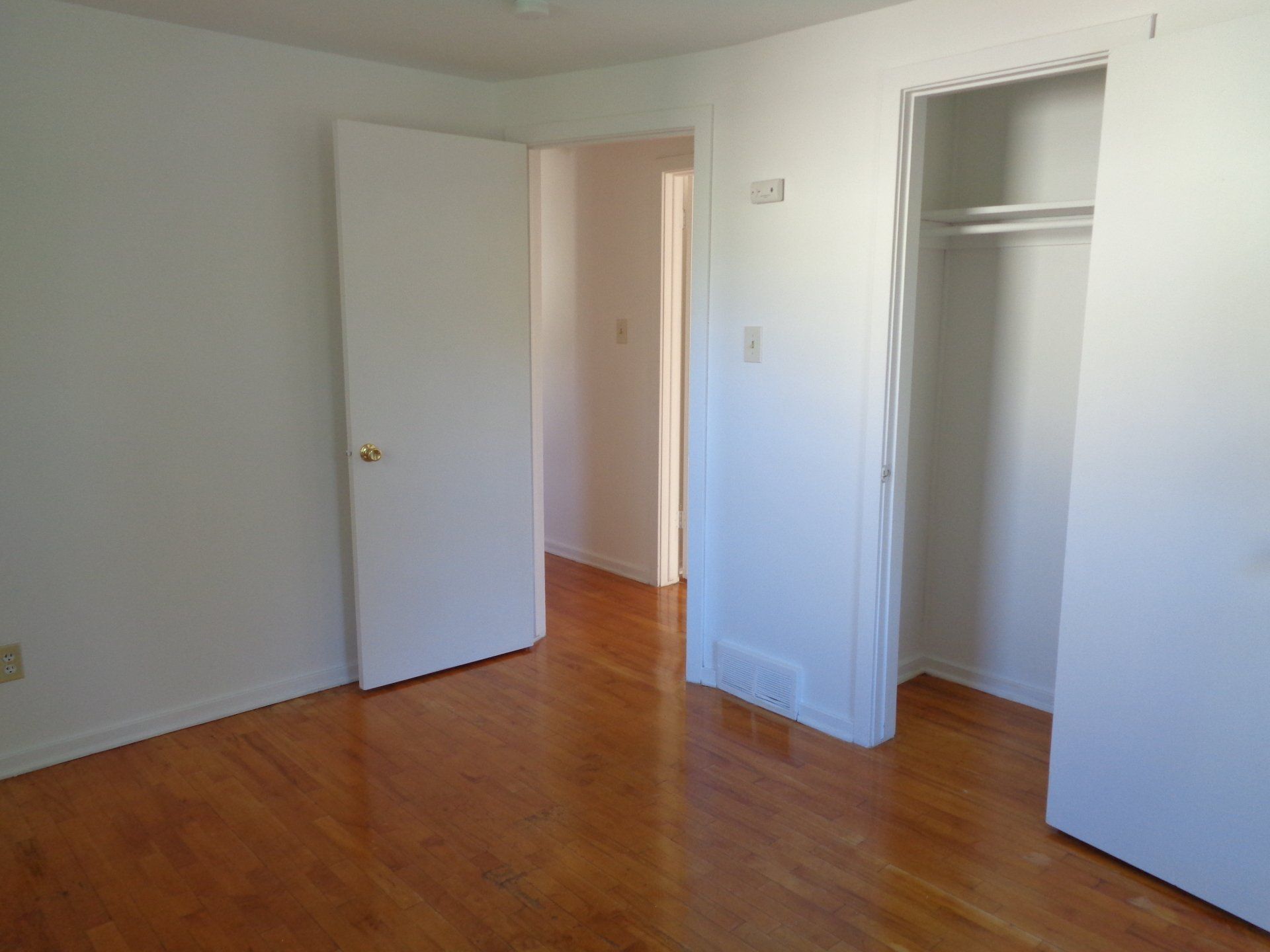 Apartment bedroom with hardwood floors
