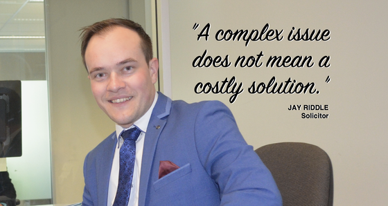 Man in suit smiling, with quote: 