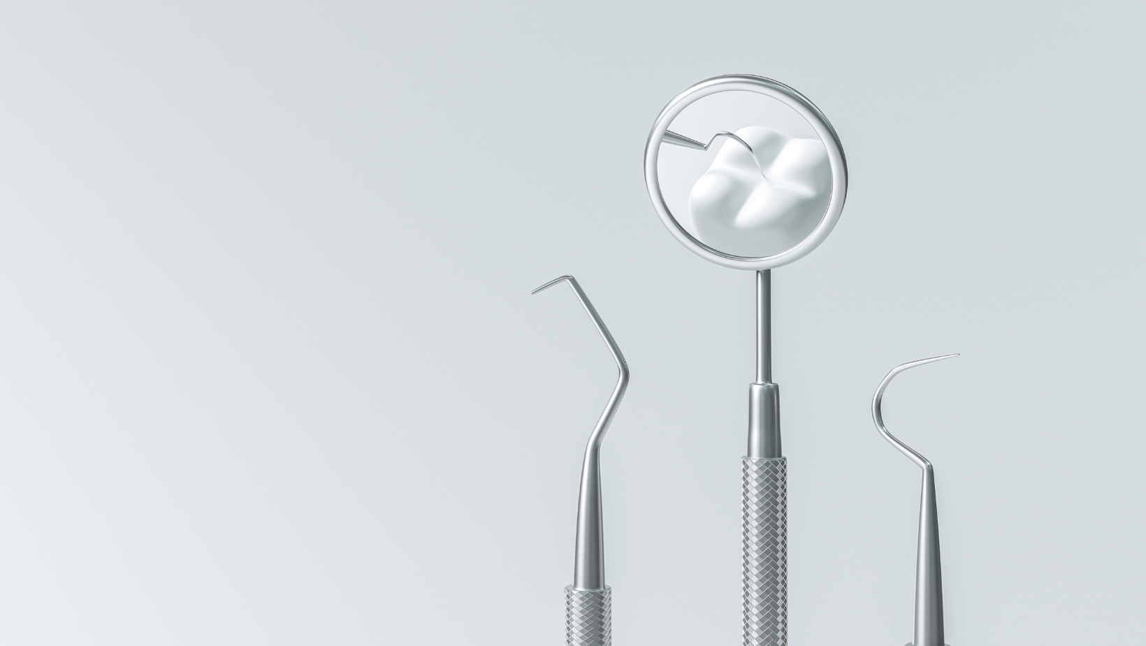 a close up of a dental mirror with a tooth in it .