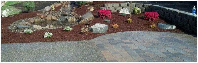A patio with a fountain in the middle of it