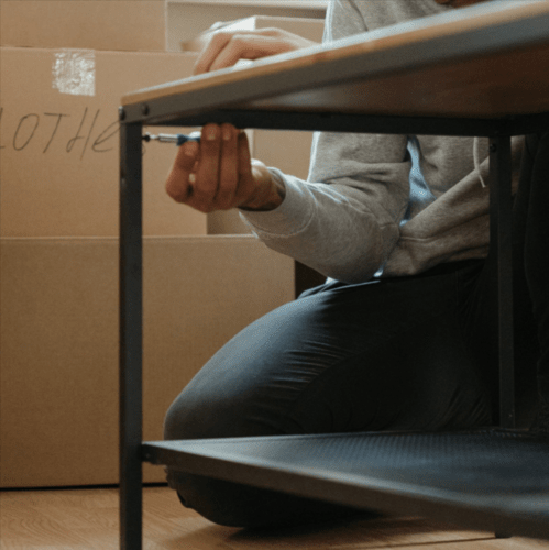 Man assembling ikea furniture