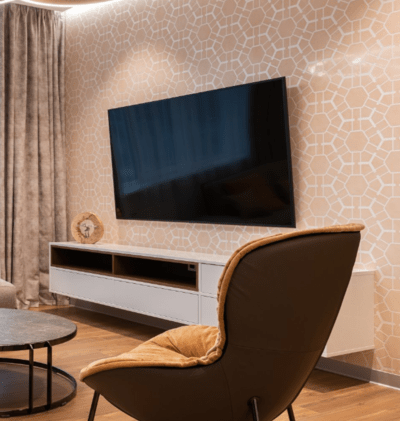 Wall mounted flat screen tv on decorative wall paper with concealed cords
