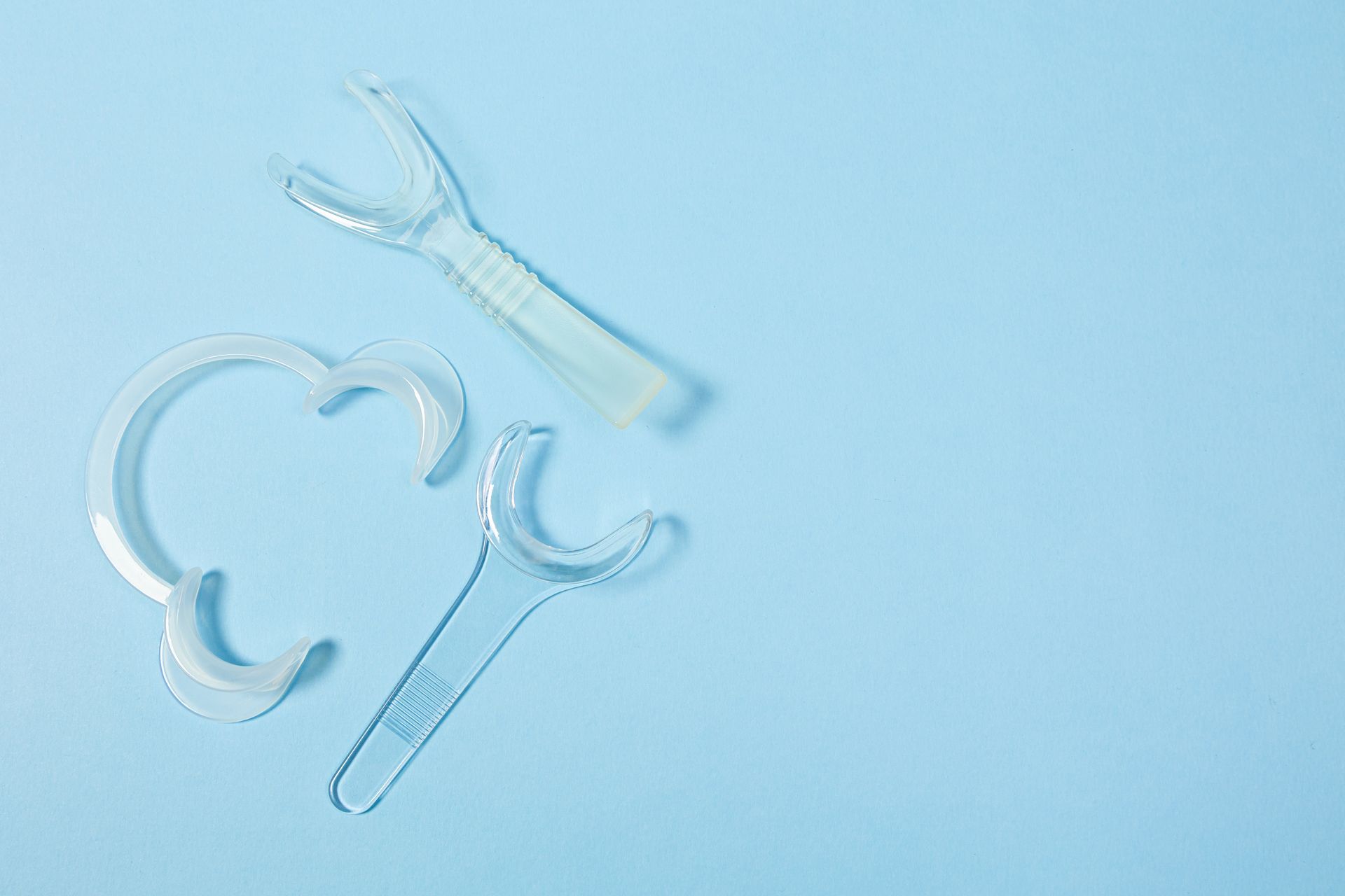 Clear medical supplies on a pale blue background