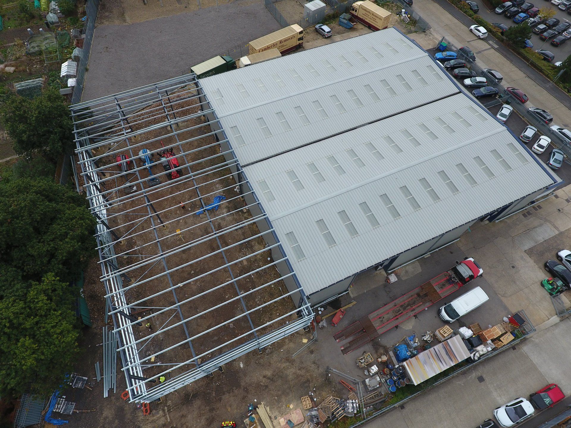 An aerial view of a large building under construction.