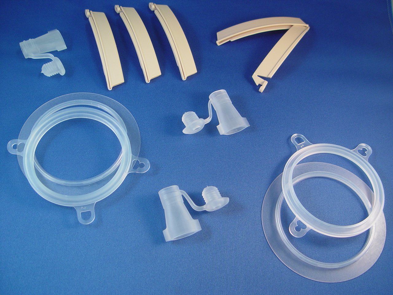 A bunch of plastic pieces on a blue surface with the number 7 on it