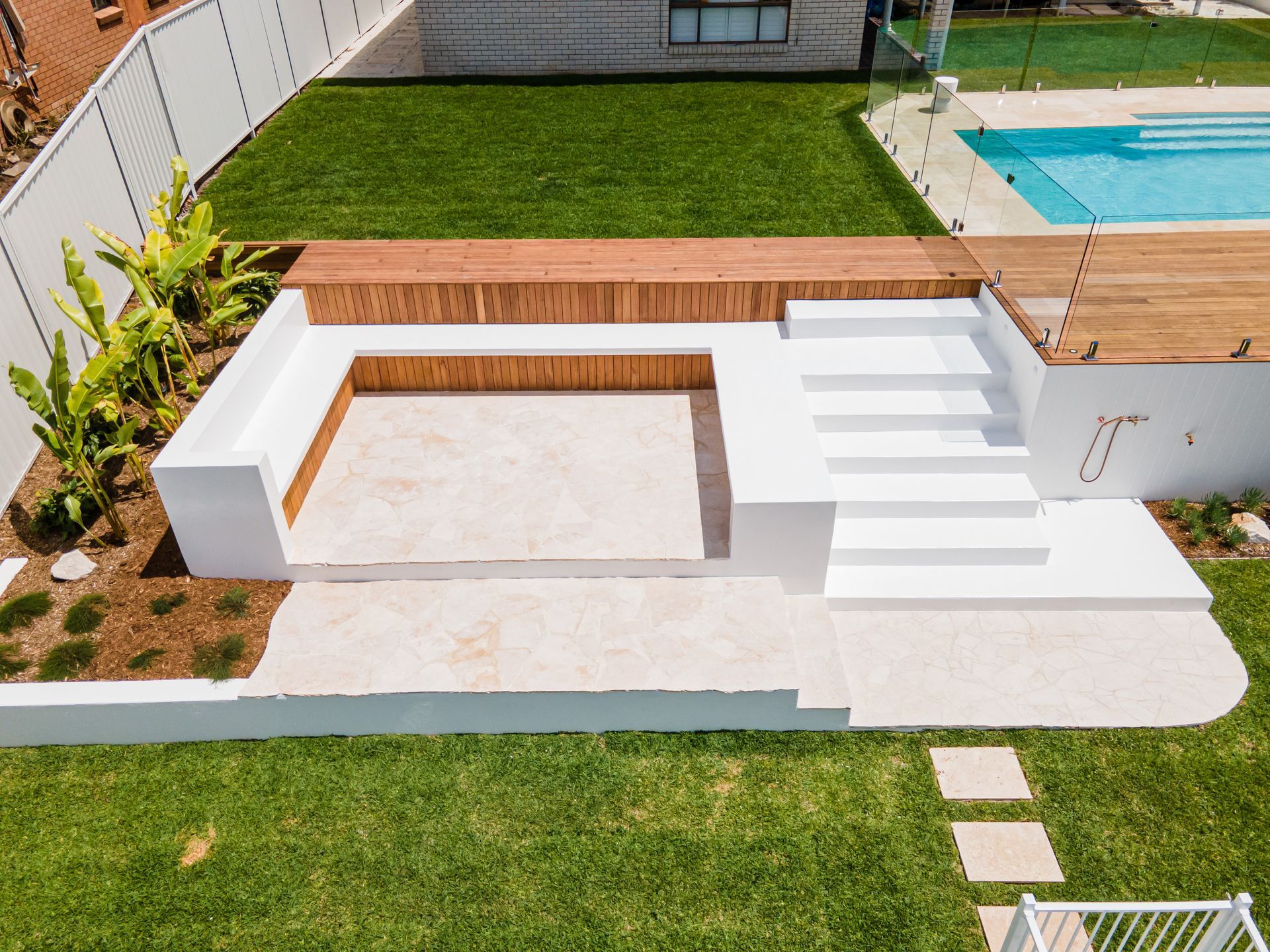 Stone cladding around a pool and deck