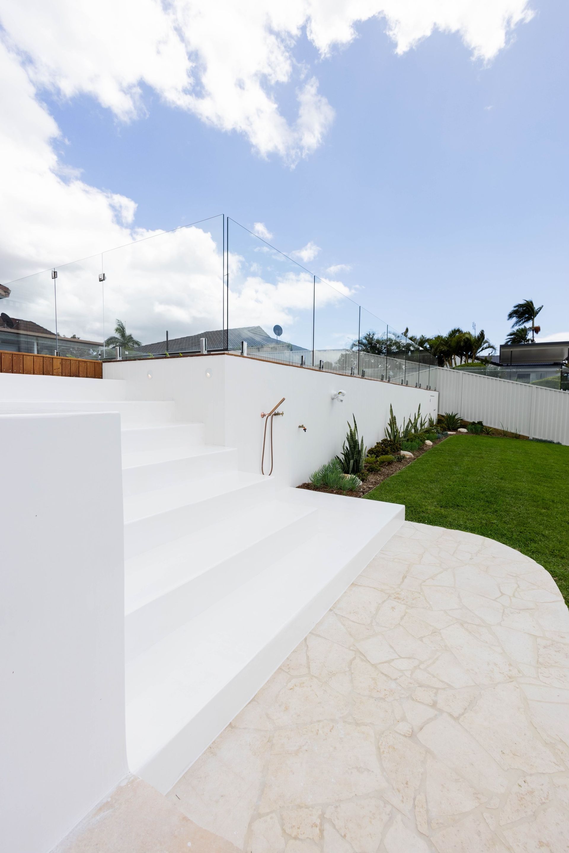 Rendered concrete steps in a backyard