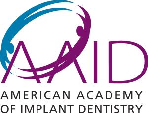 Logo for the American Academy of Implant Dentistry featuring purple stylized text and a blue and purple oval icon.