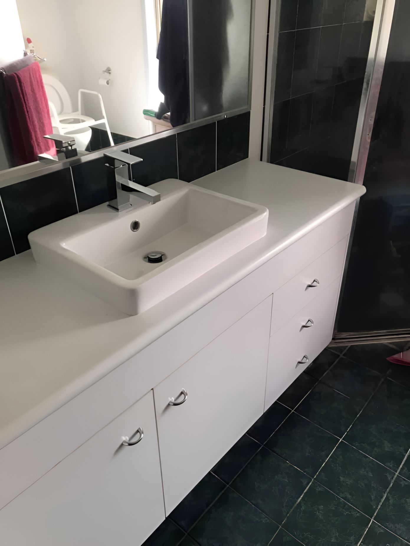 A Bathroom With A Sink, Mirror And Toilet — Casino Plumbing In Casino, NSW