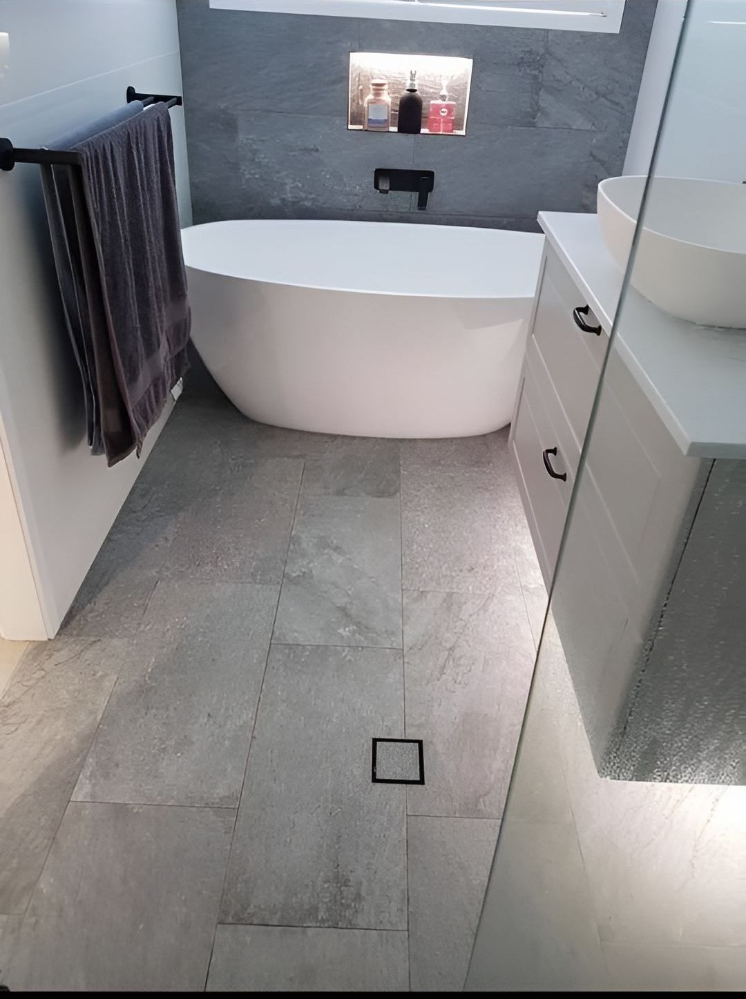 A Bathroom With A Bathtub, Sink And Mirror — Casino Plumbing In Casino, NSW