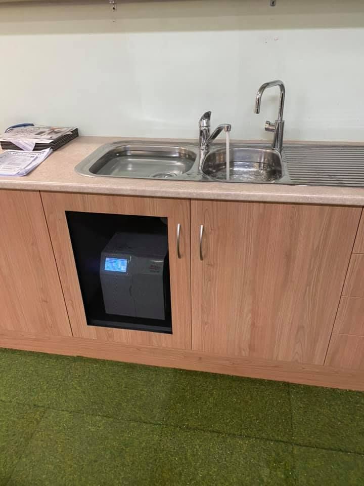 A Kitchen Sink With Wooden Cabinets And A Faucet — Casino Plumbing In Casino, NSW