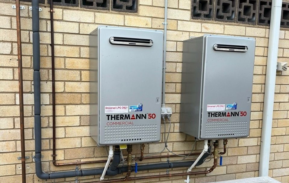 A Building Under Construction With A Lot Of Pipes — Casino Plumbing In Casino, NSW