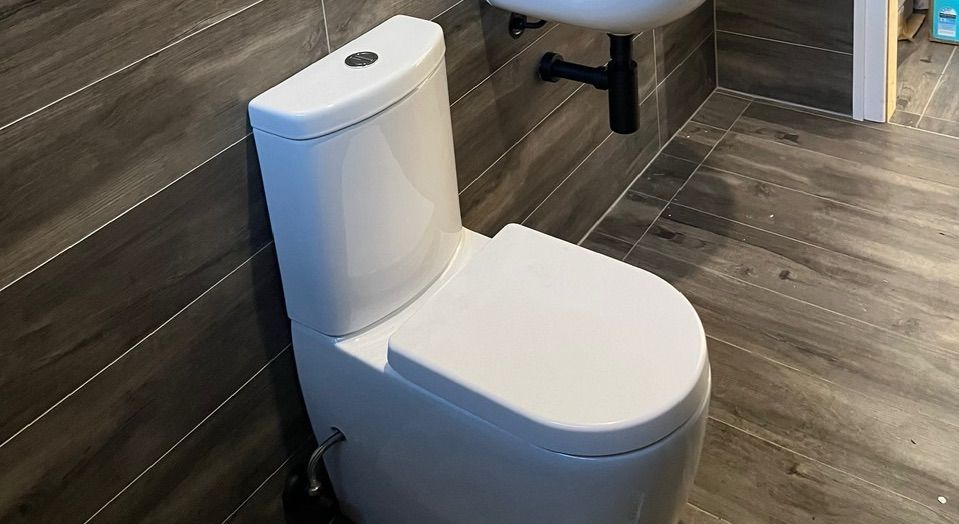 A Bathroom With A Bathtub, Toilet, Sink And Shower — Casino Plumbing In Casino, NSW