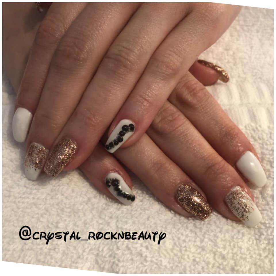 A close up of a woman 's nails with the words @crystal_rocknbeauty on the bottom