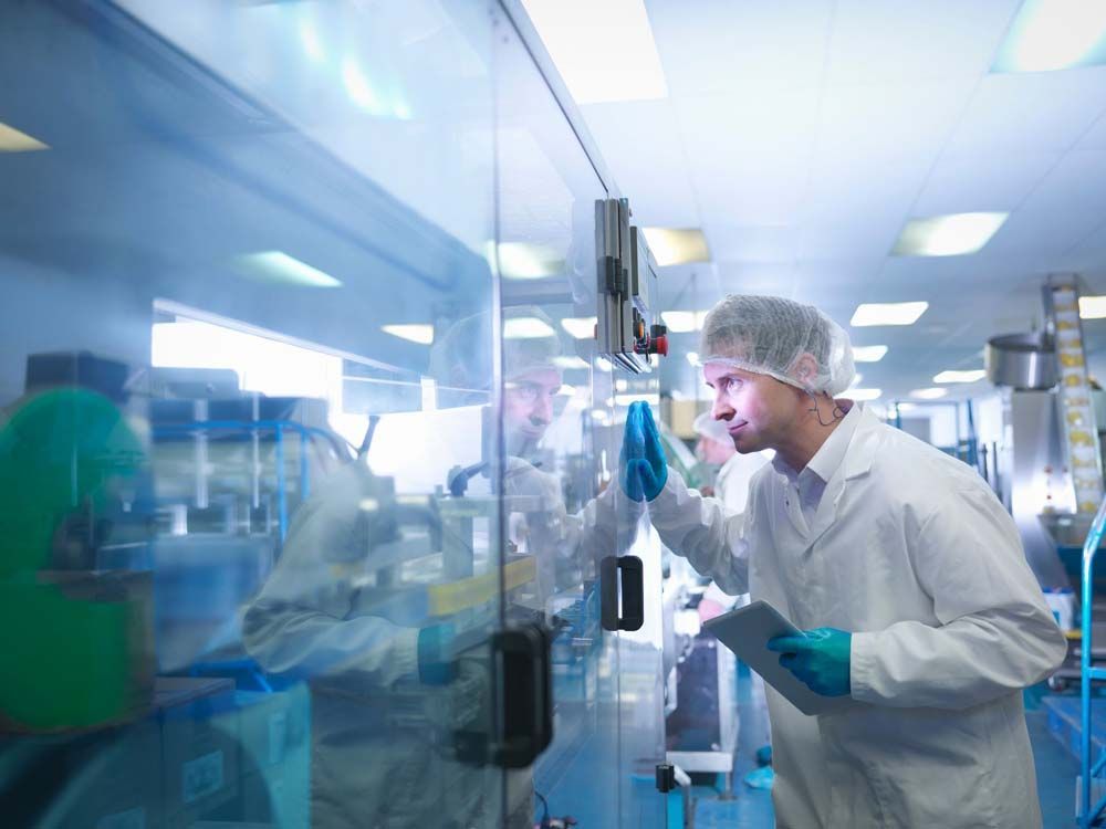Worker inspecting equipment in an environmental chamber, ensuring proper maintenance and quality control | Koch Environmental Worker inspecting equipment in an environmental chamber, ensuring proper maintenance and quality control | Koch Environmental