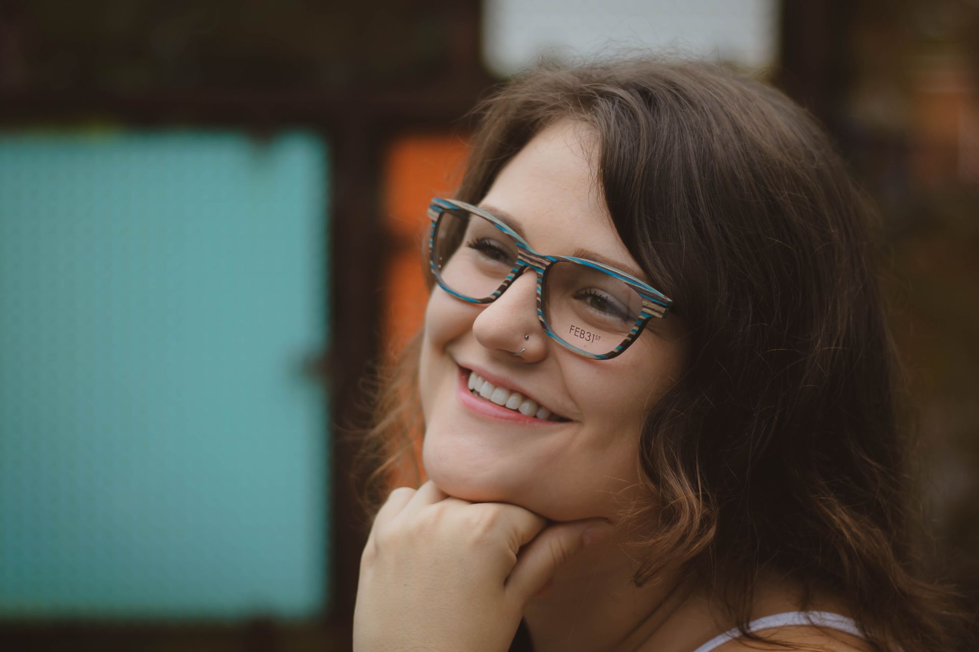 woman smiling and wearing glasses