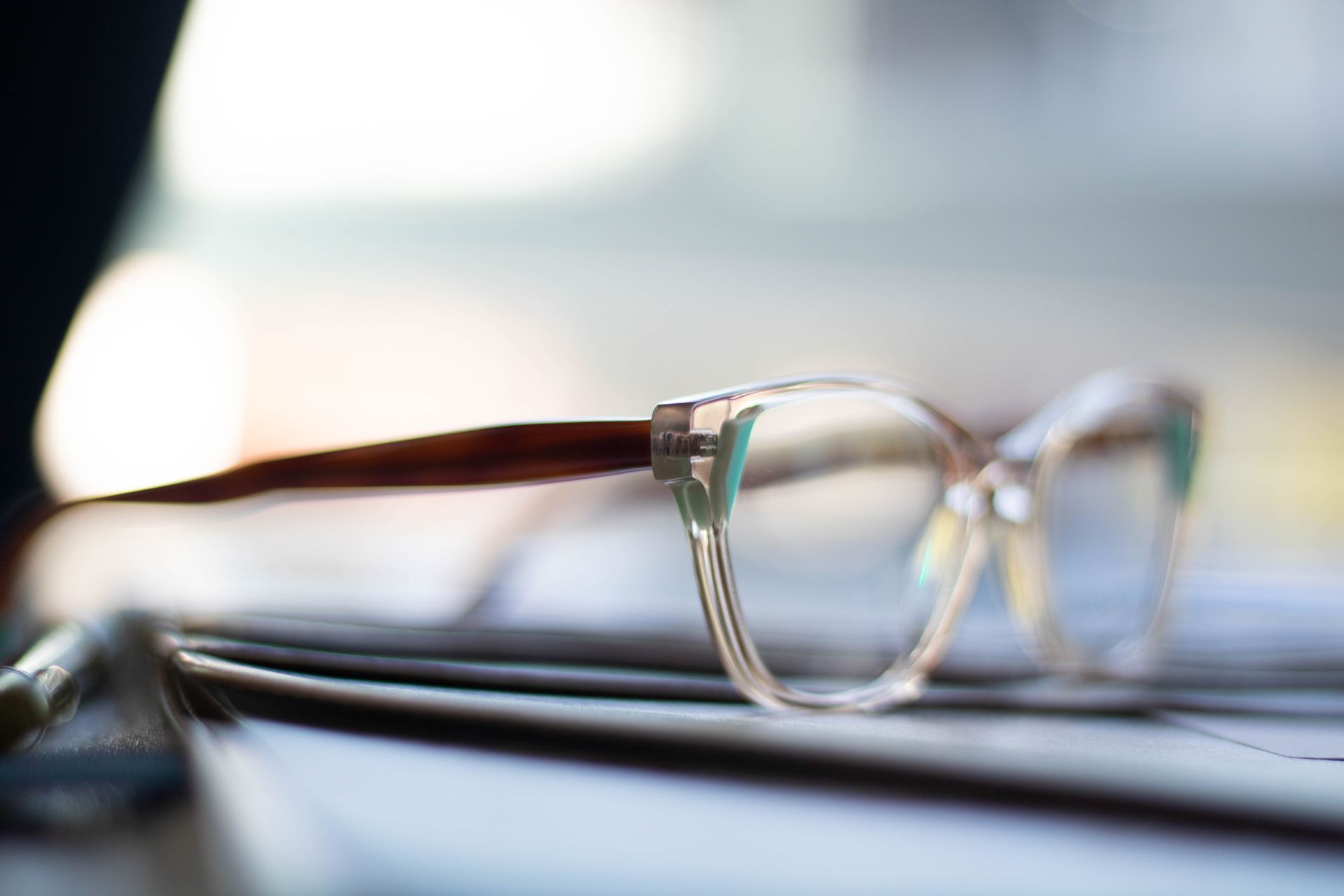 clear frames with teal detailing; Winter Eye Care & Night Vision Tips blog