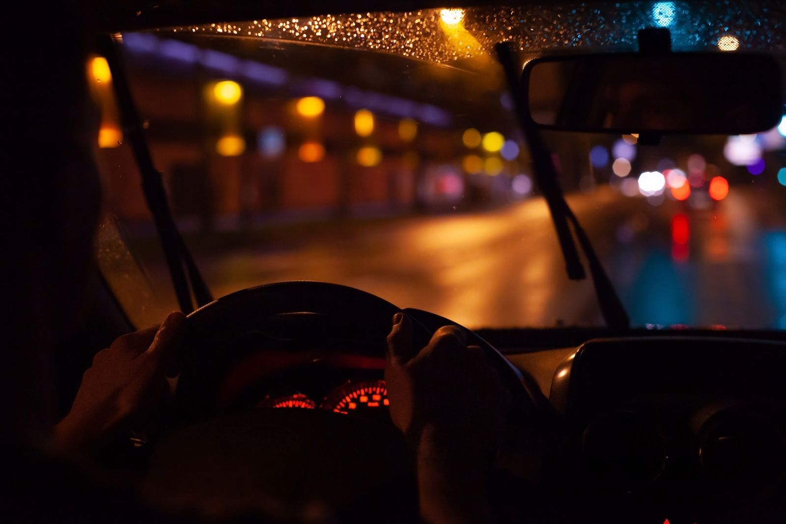 Person driving car at night in the rain. Shamir Lenses - Why It’s Harder to See at Night