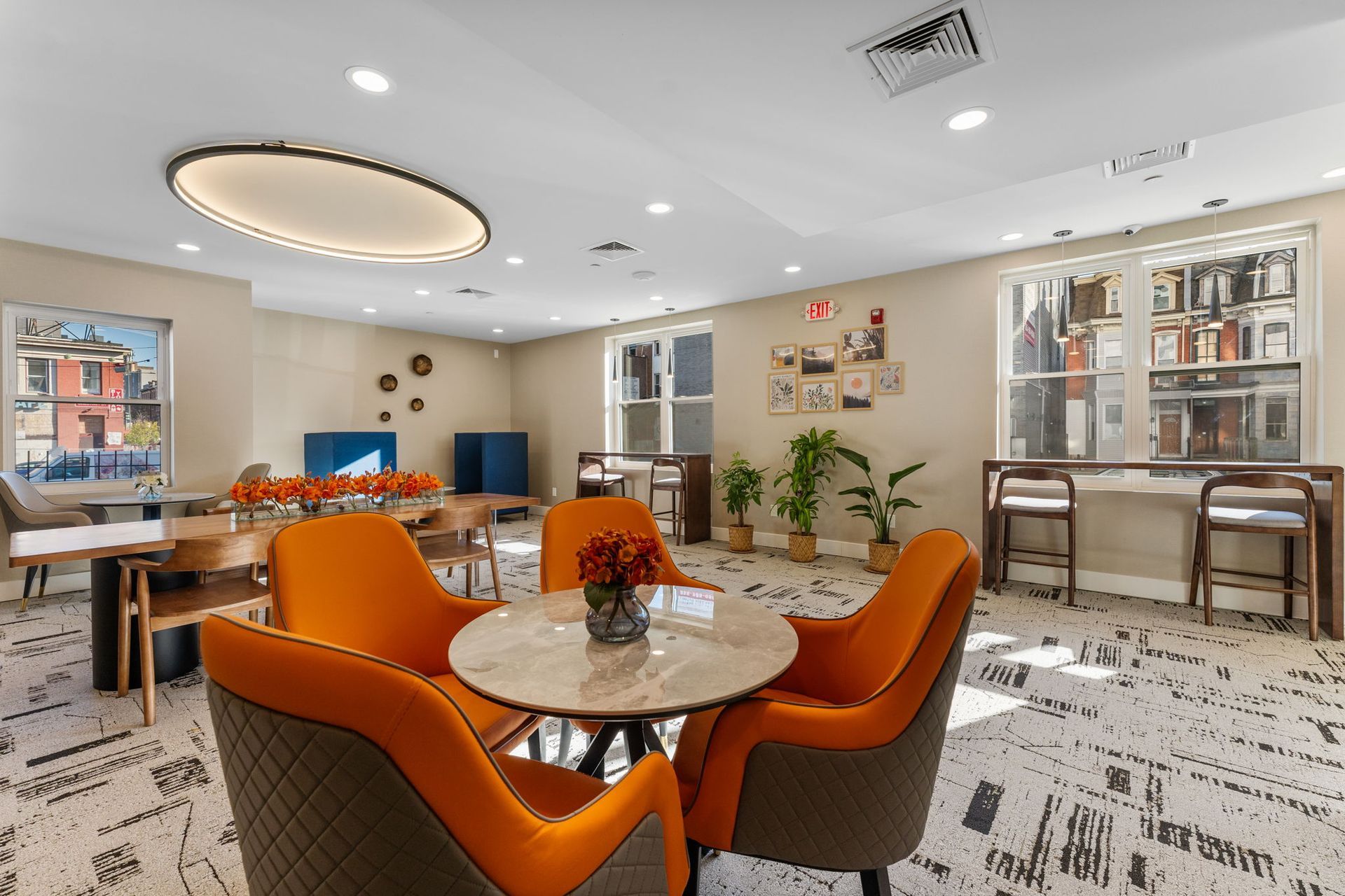 A living room with a table and chairs in it.