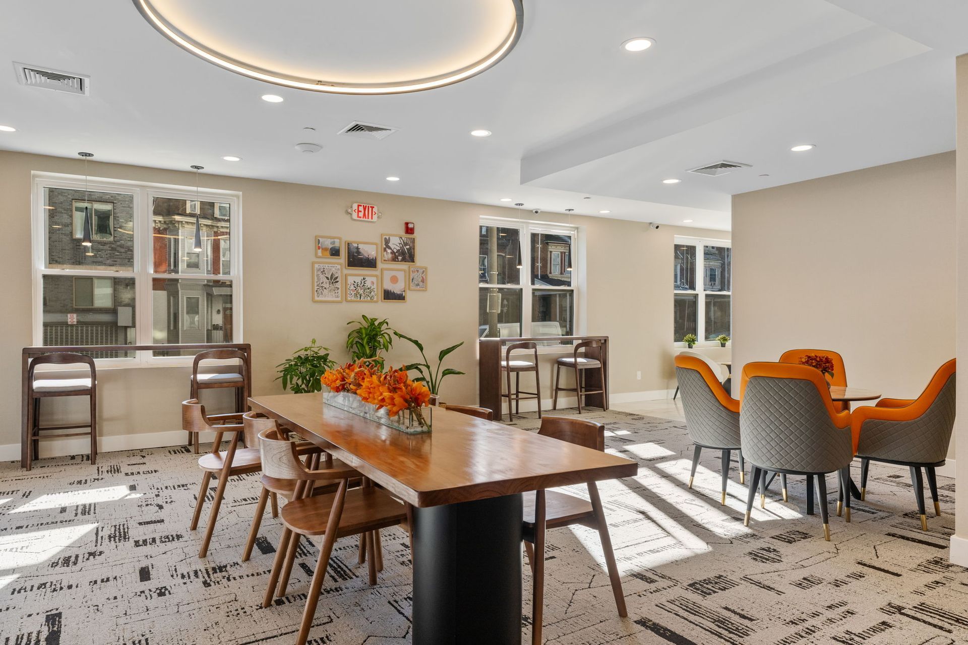 A large room with a table and chairs in it