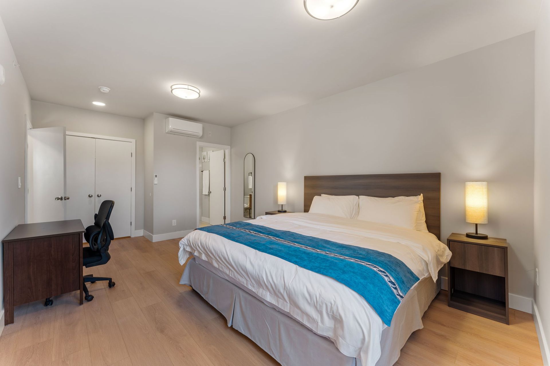 There is a large bed in the middle of the room.