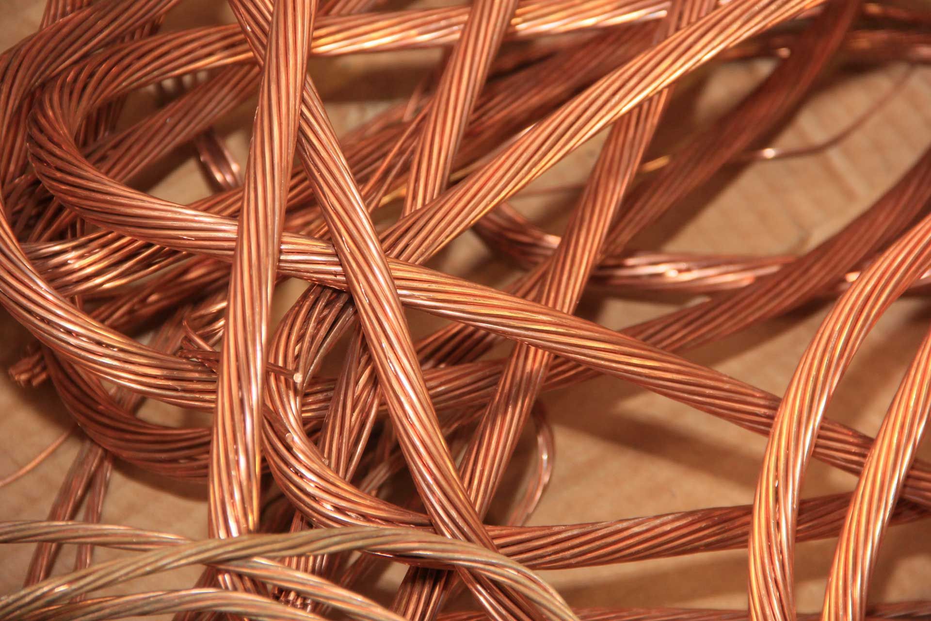 Tightly coiled copper wires with a shiny metallic surface.