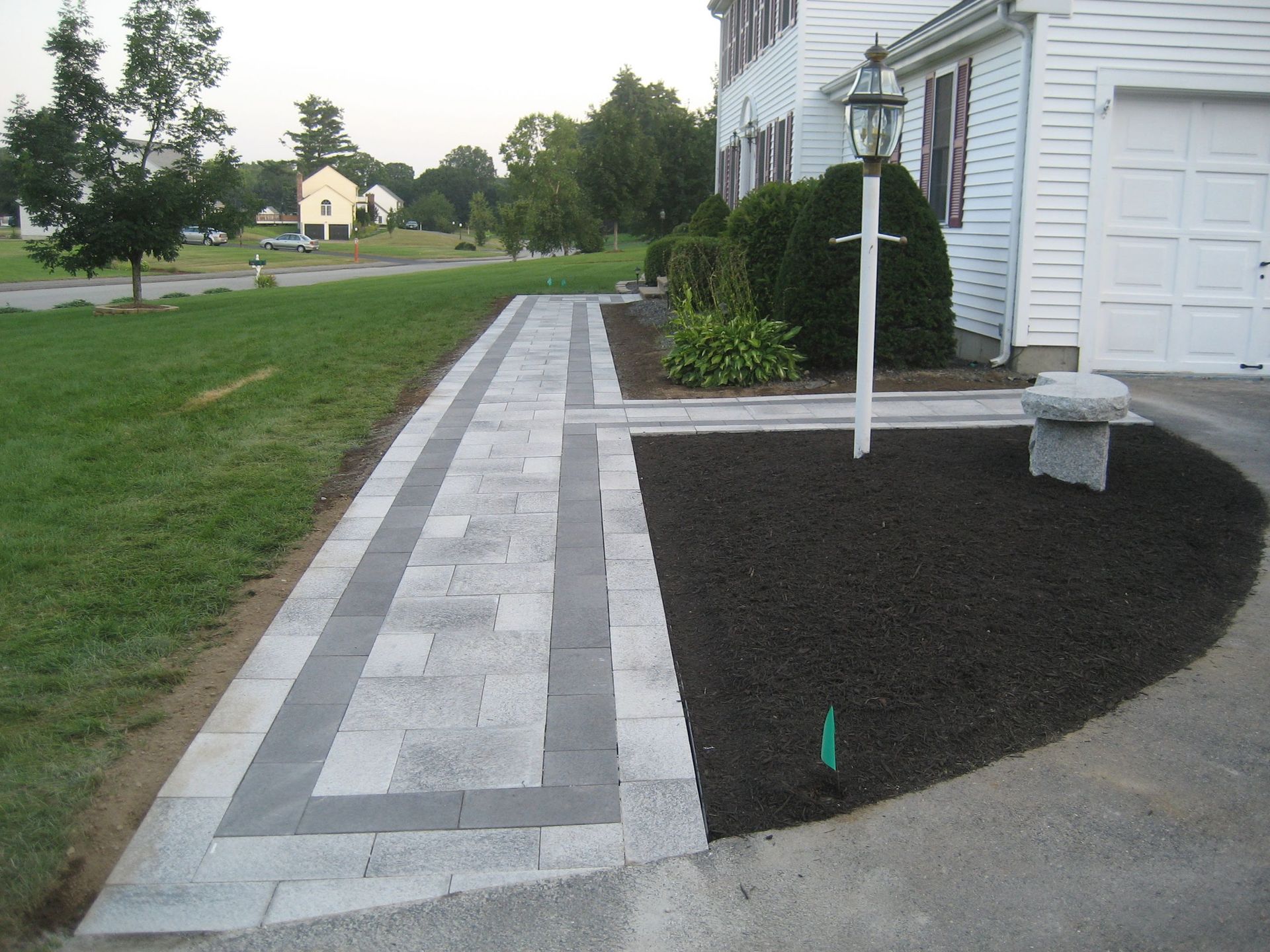 A white house with a walkway leading to it