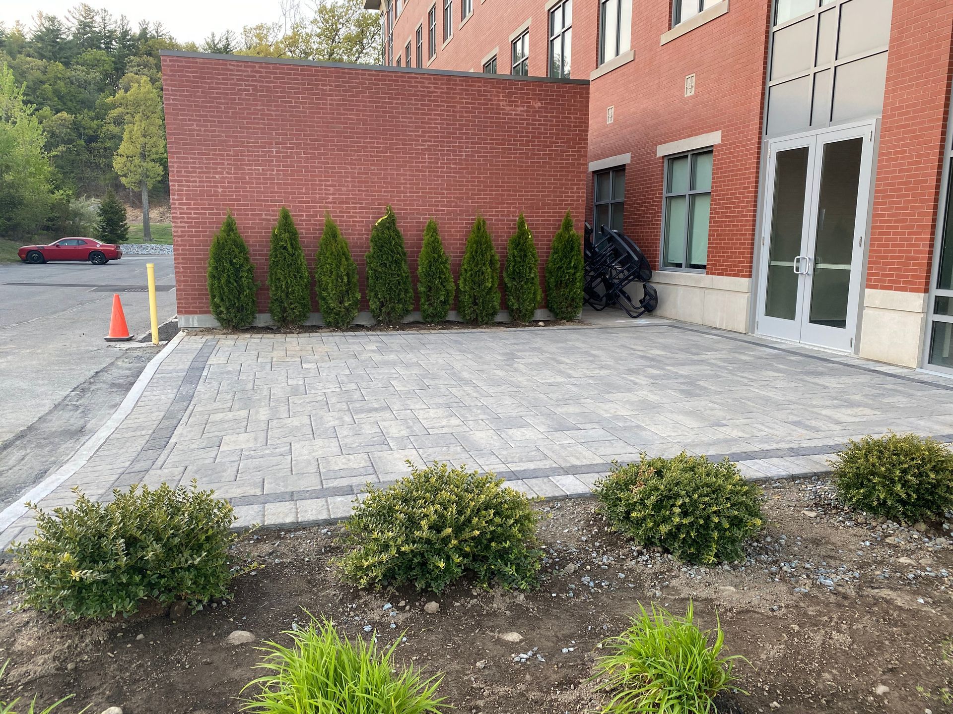 A brick building with a patio in front of it