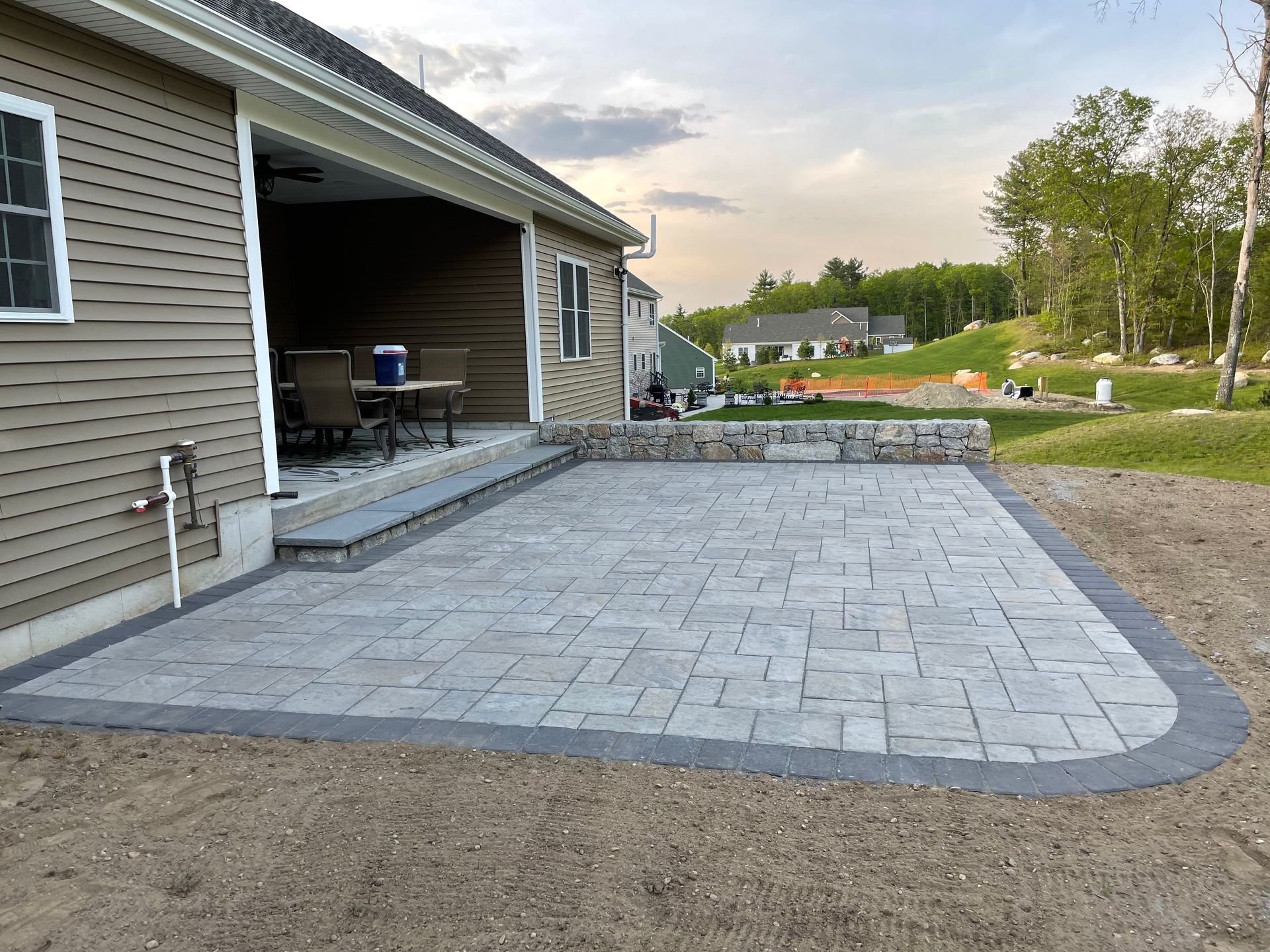 A patio with a couch and a coffee table