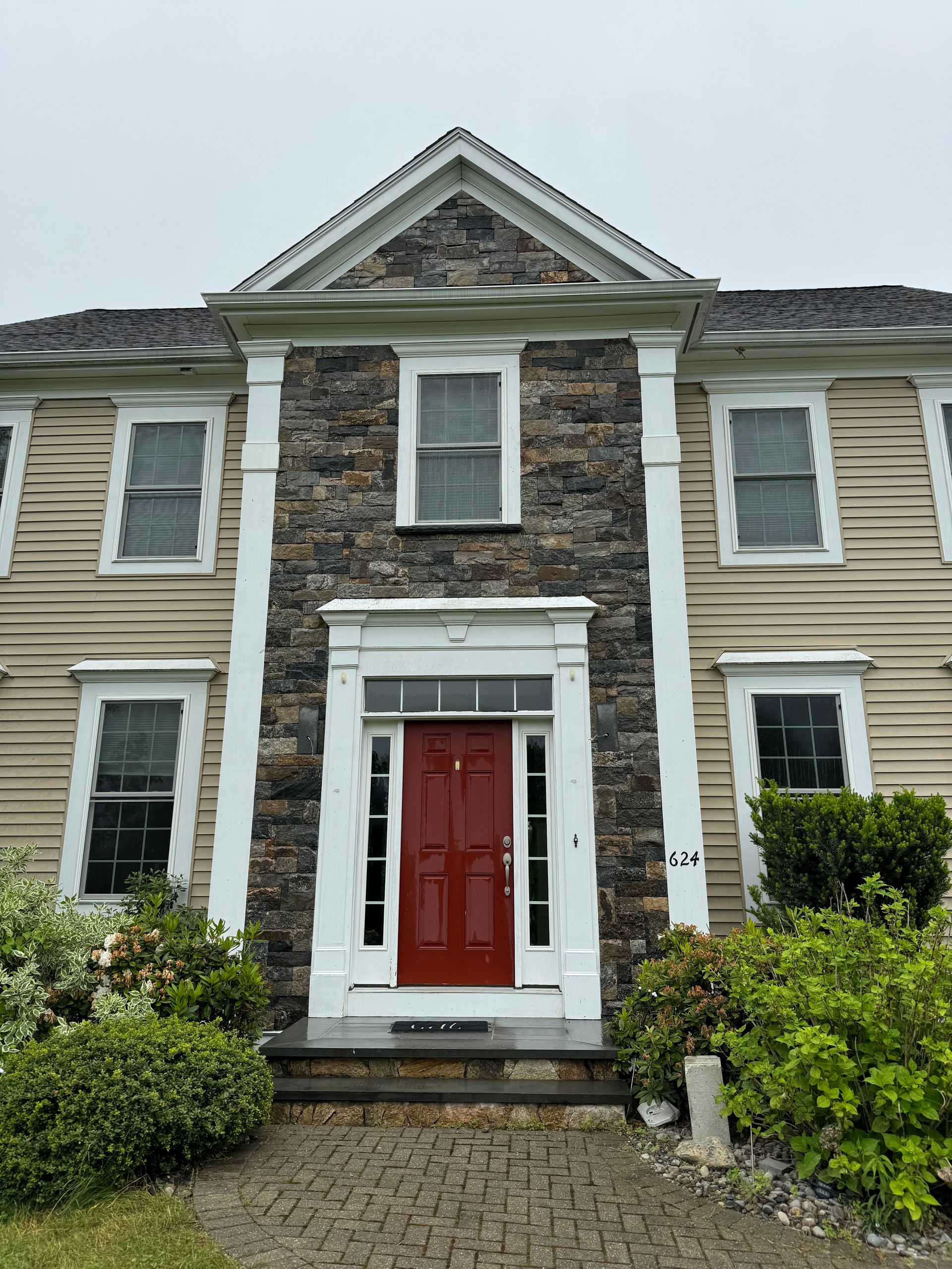 A brick wall with plants growing on it