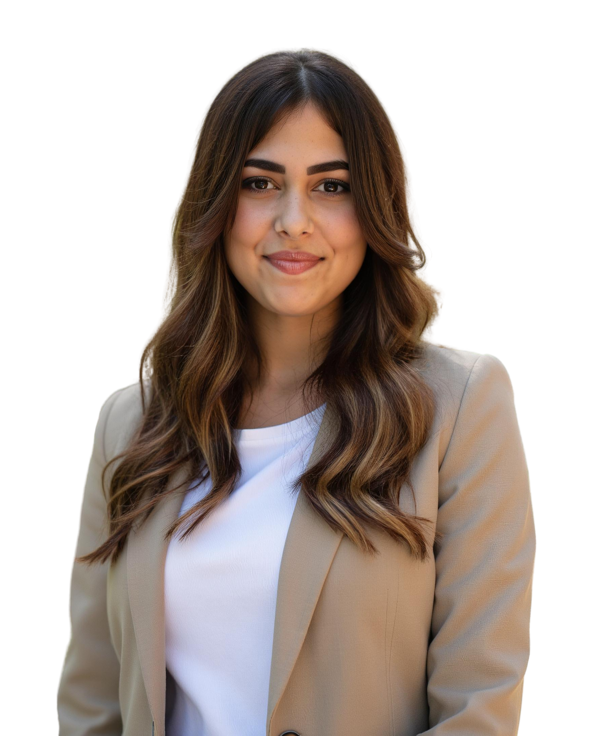 A woman in a suit is sitting at a table with a laptop.