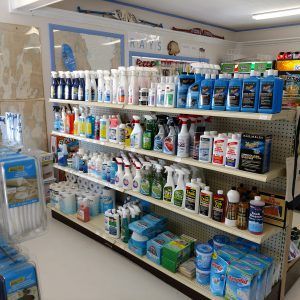 A store shelf filled with lots of cleaning supplies.
