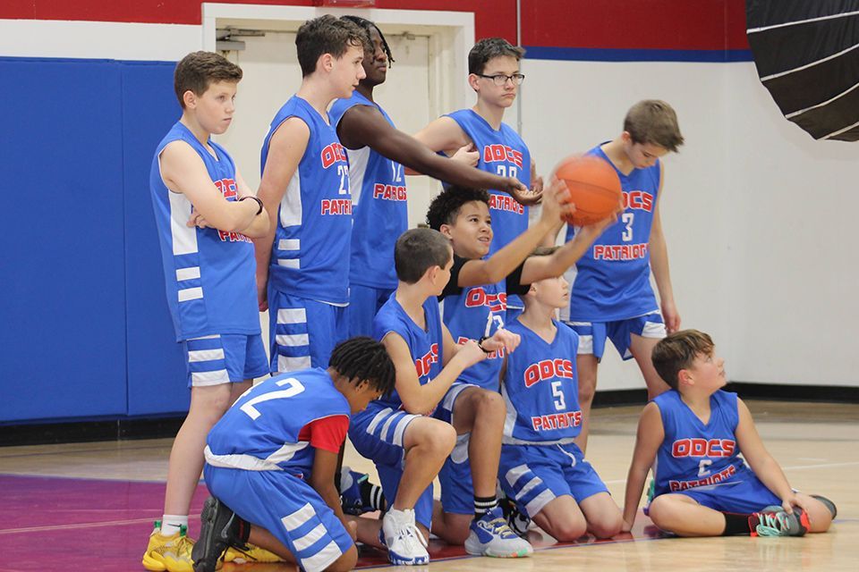 One of the Middle School boys basketball teams poses for a portrait