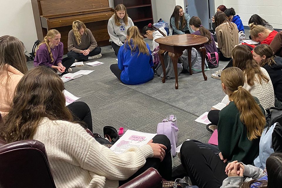 A group of students are praying.