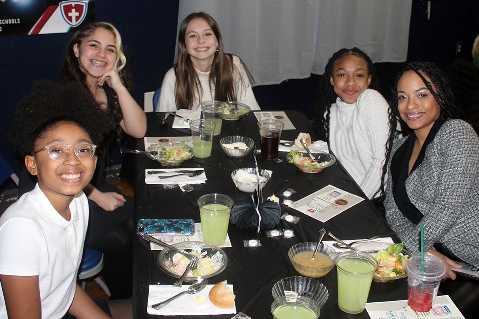 Students and parents dining at a fundraiser