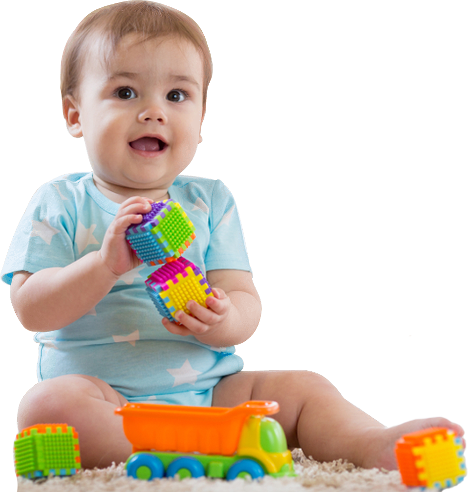 baby boy playing toys in nursery or daycare