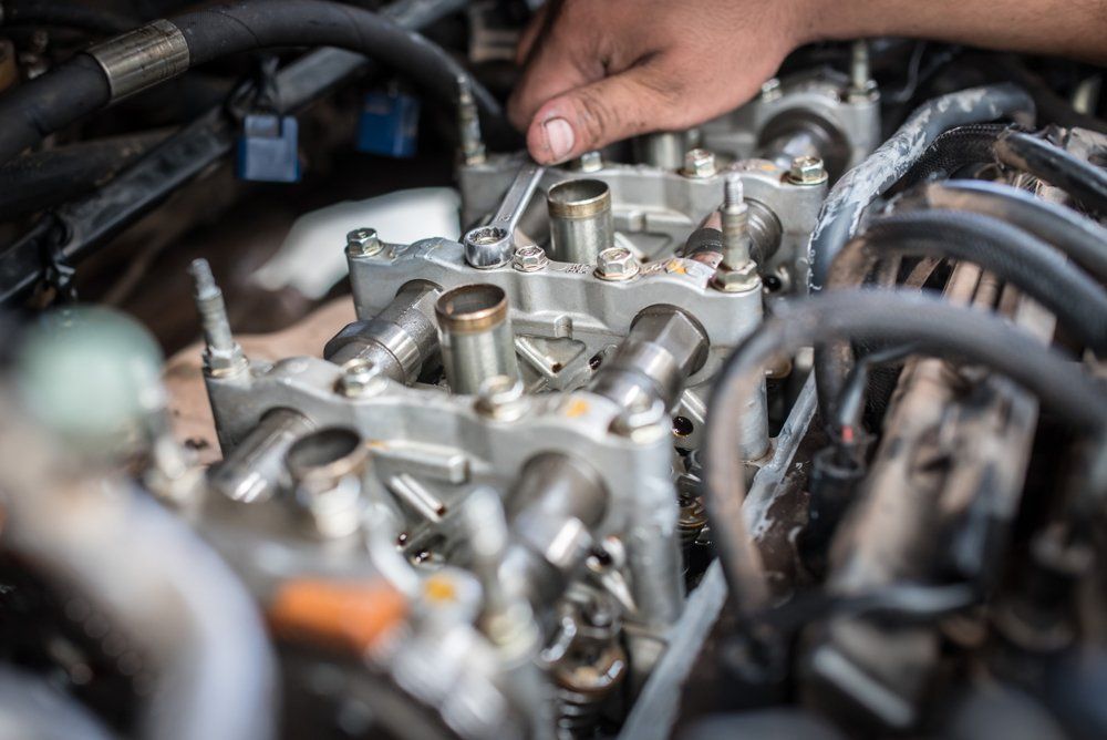 A Close up Of a Person Working on A Car Engine — Emu Park Automotive and Tyre Service in Emu Park, QLD