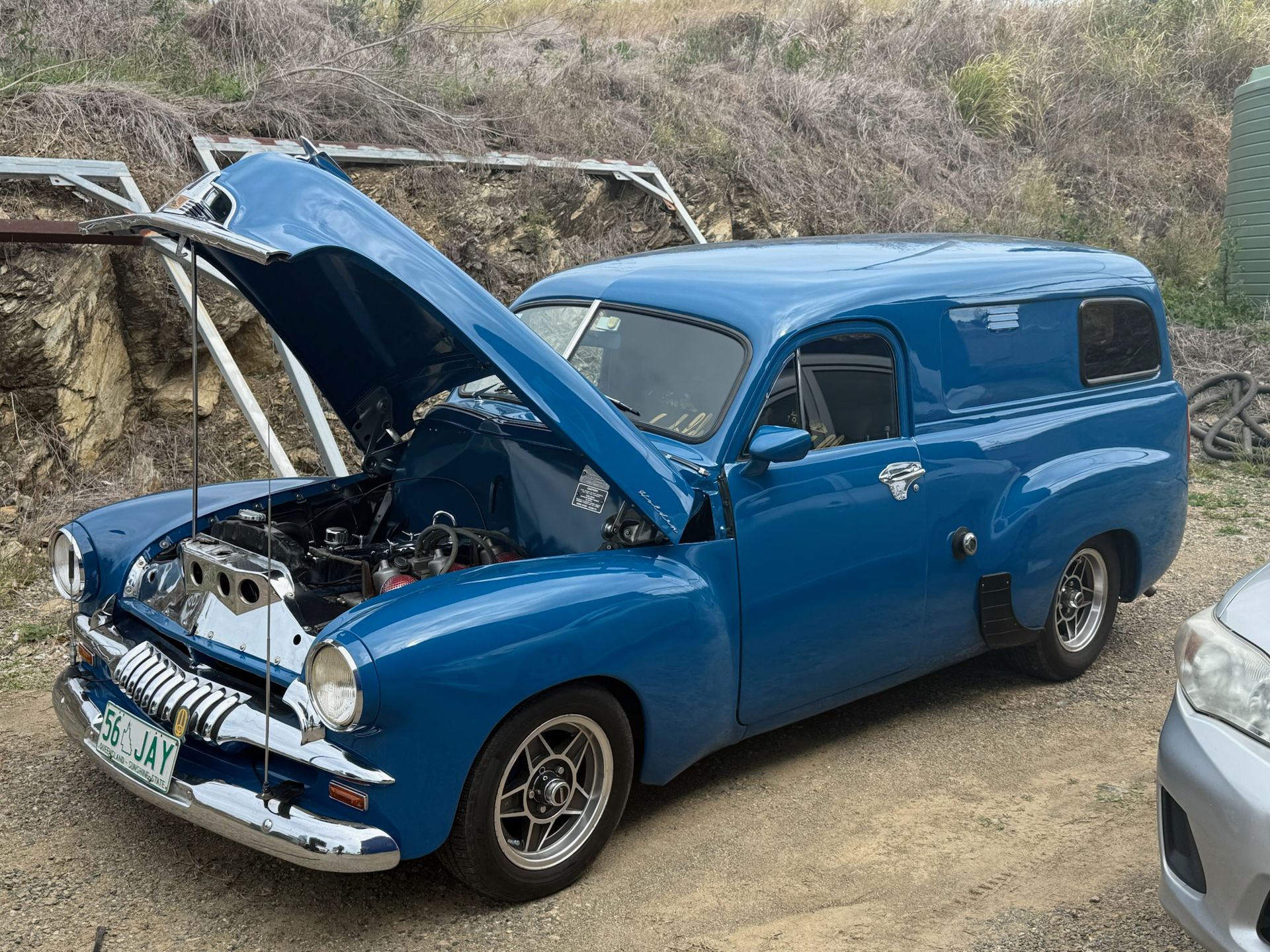 Blue vintage car with hood open at an outdoor roadside setting  — Emu Park Automotive and Tyre Service in Emu Park, QLD