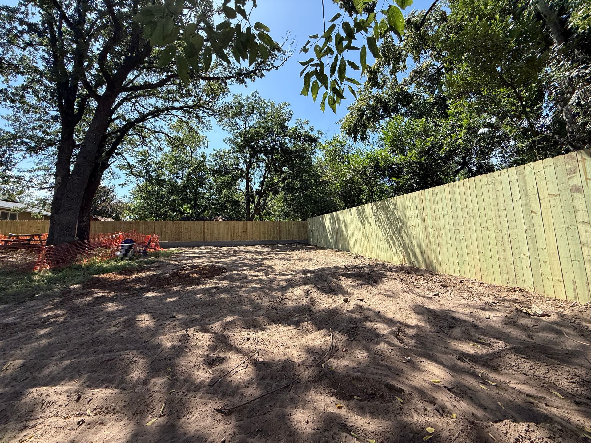 a man is using a chainsaw to cut a tree