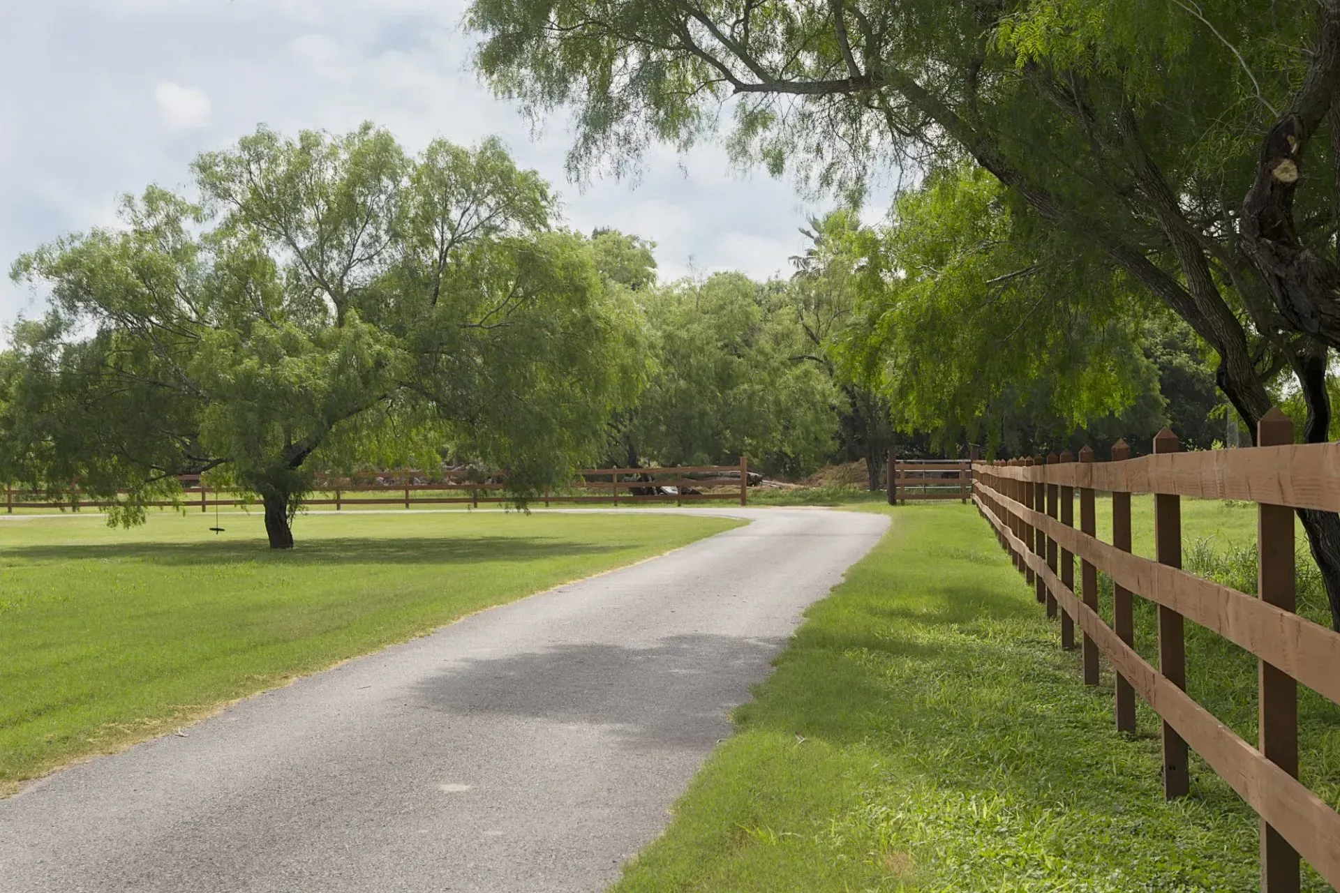 A modern house with a car parked in front of it.