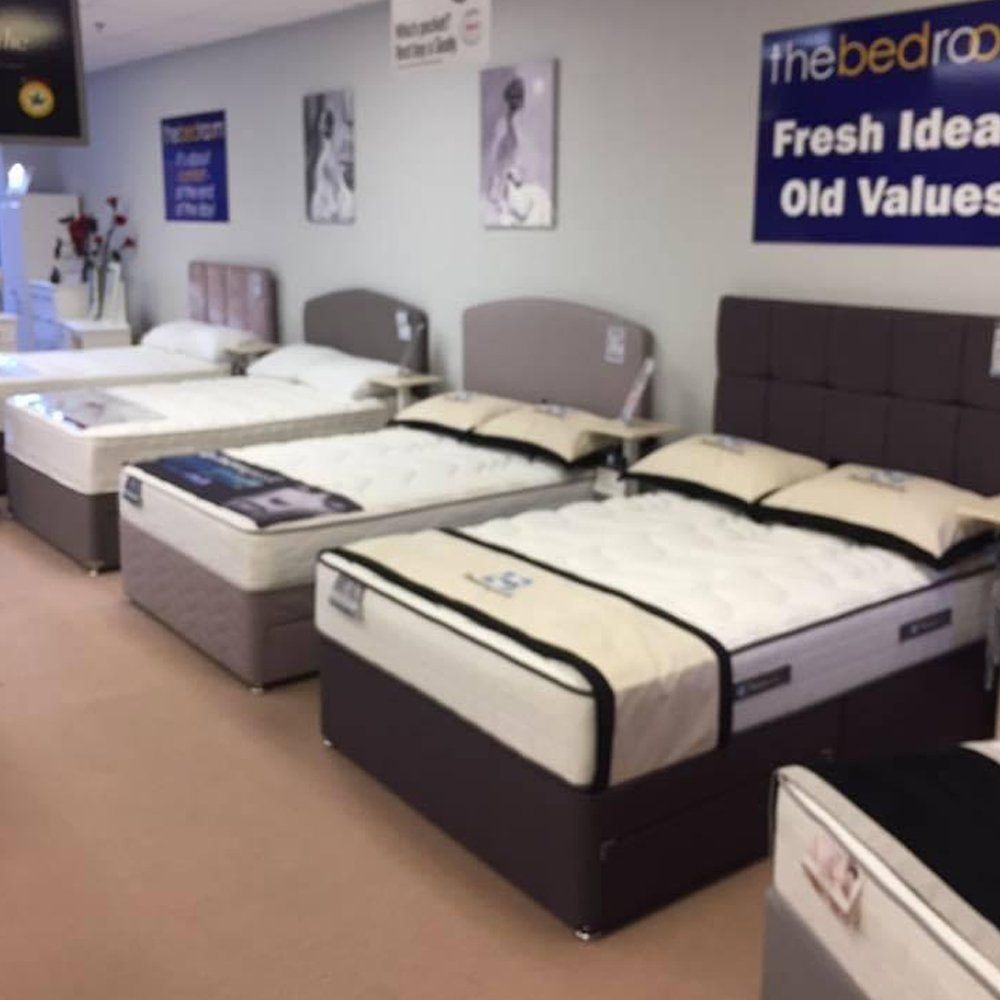 Row of beds in a showroom