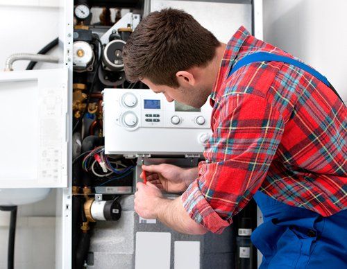 Technician Servicing Heating Boiler — Wimauma, FL — Reedy Plumbing