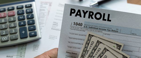 Business — Payroll Form with Money and Calculator in Skokie, IL