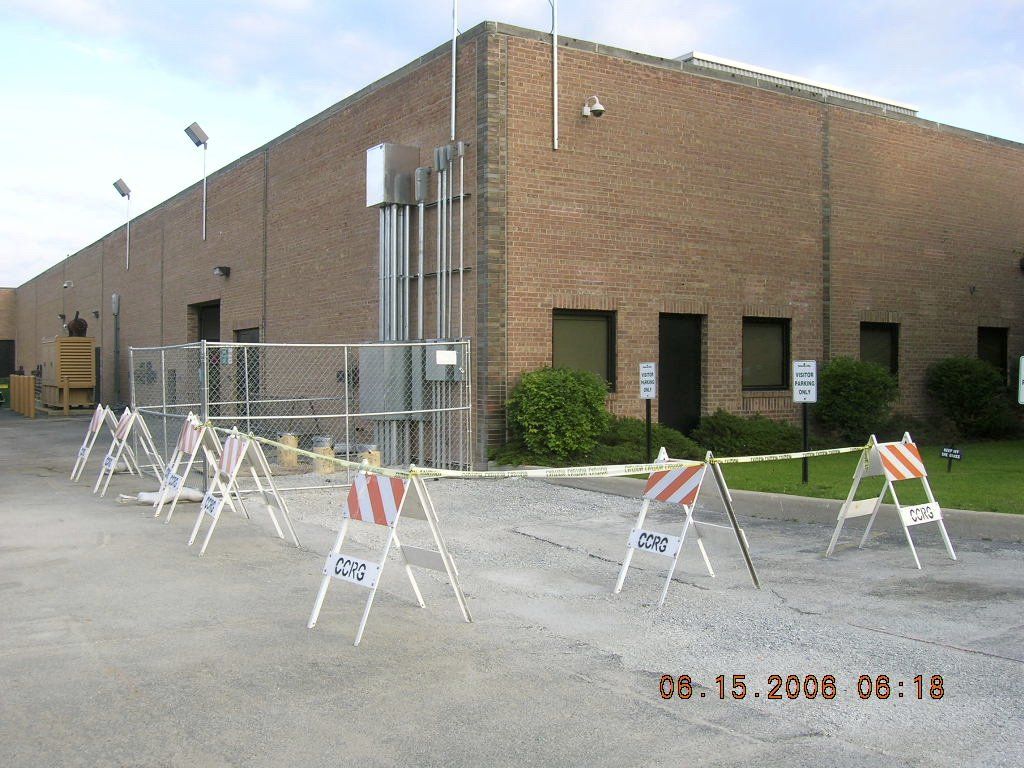 A brick building with a lot of signs in front of it