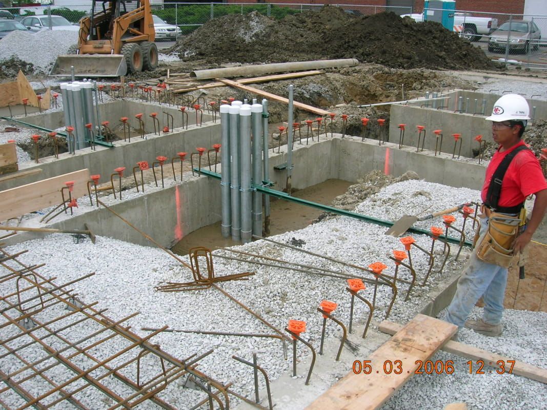 A construction site with a man wearing a hard hat