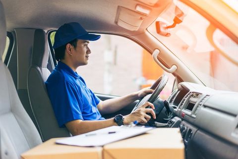 Professional Delivery — Delivery Man with Packages on The Front Seat in Huntsville, AL